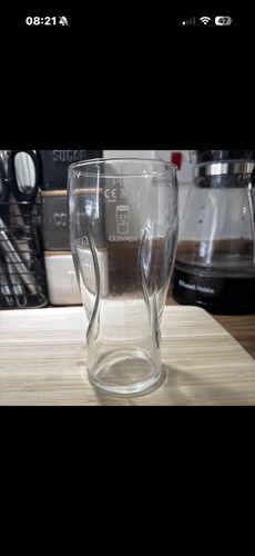 One 20oz guinness official - 20oz.,